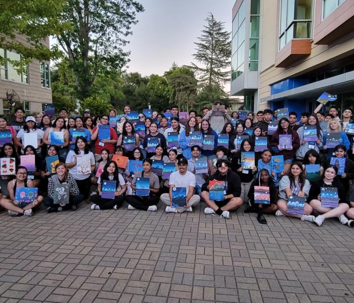 Group photo of Summer Bridge 2024 program participants at Paint Night